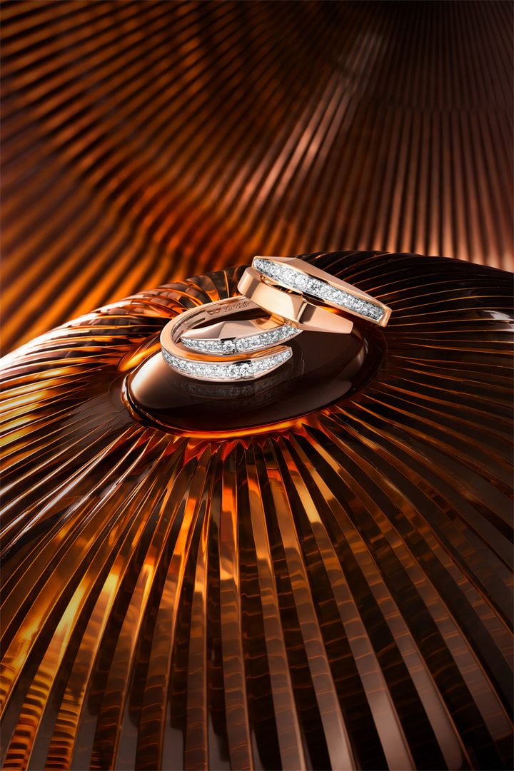 Rose gold diamond bangle and ring on a bronze fluted set