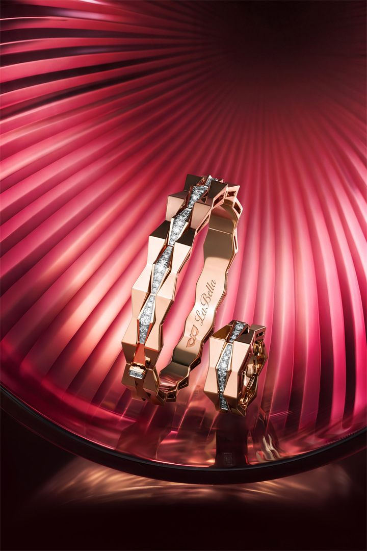 Rose gold geometric diamond jewellery on red fluted glass