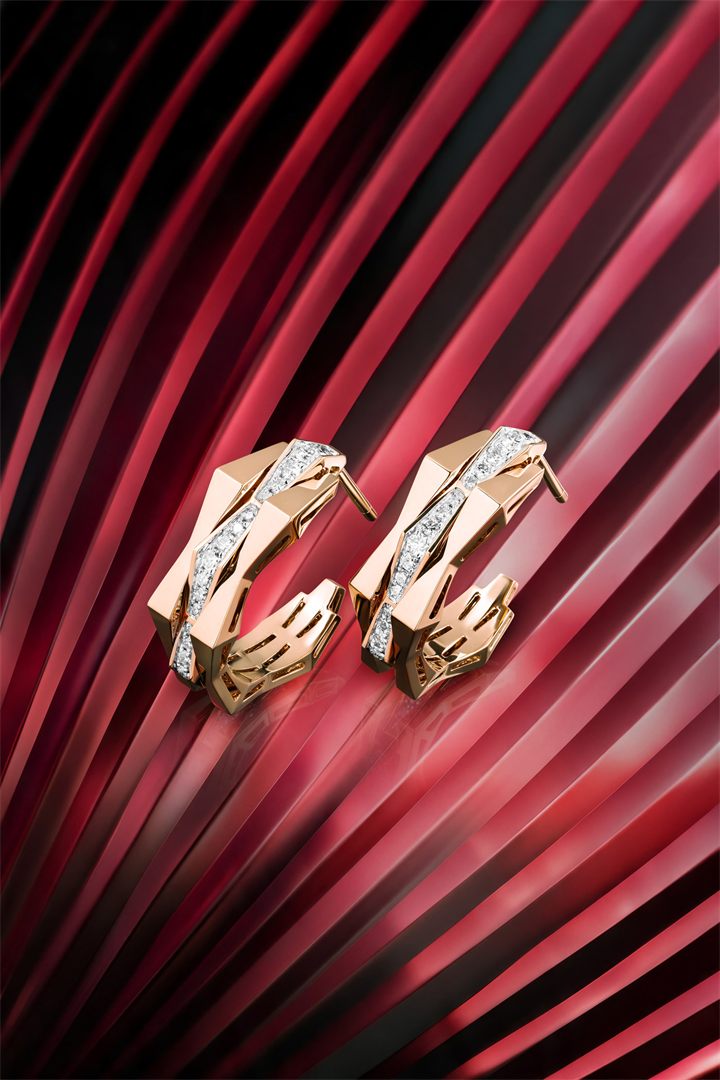 Rose gold geometric diamond jewellery on red fluted glass