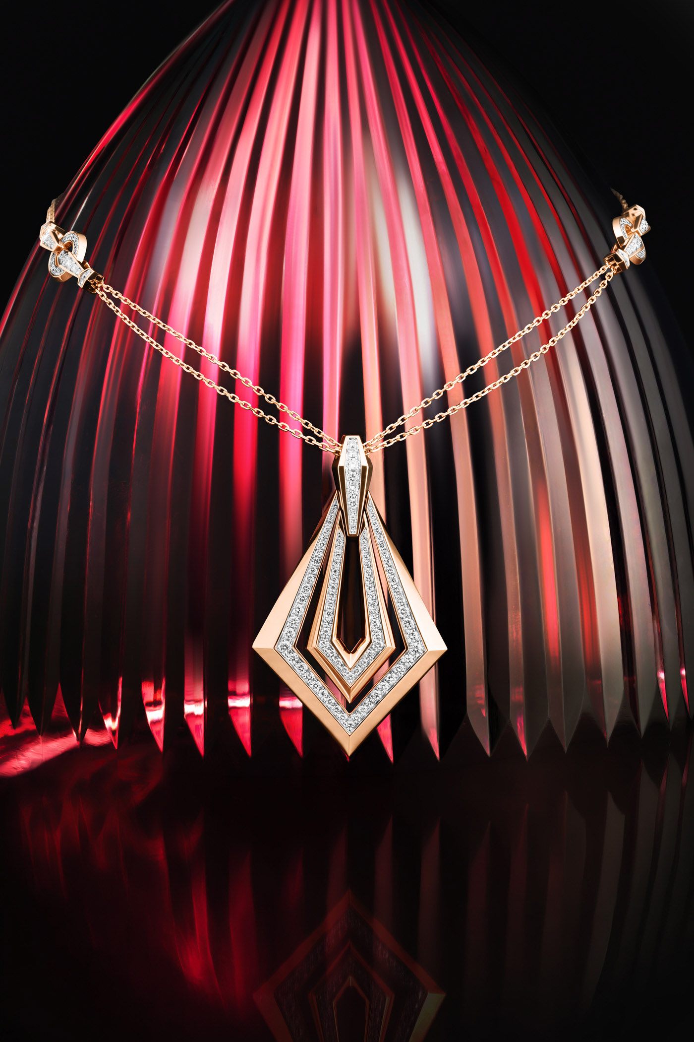 Rose gold diamond pendant on a red fluted set, jewellery photography in Dubai