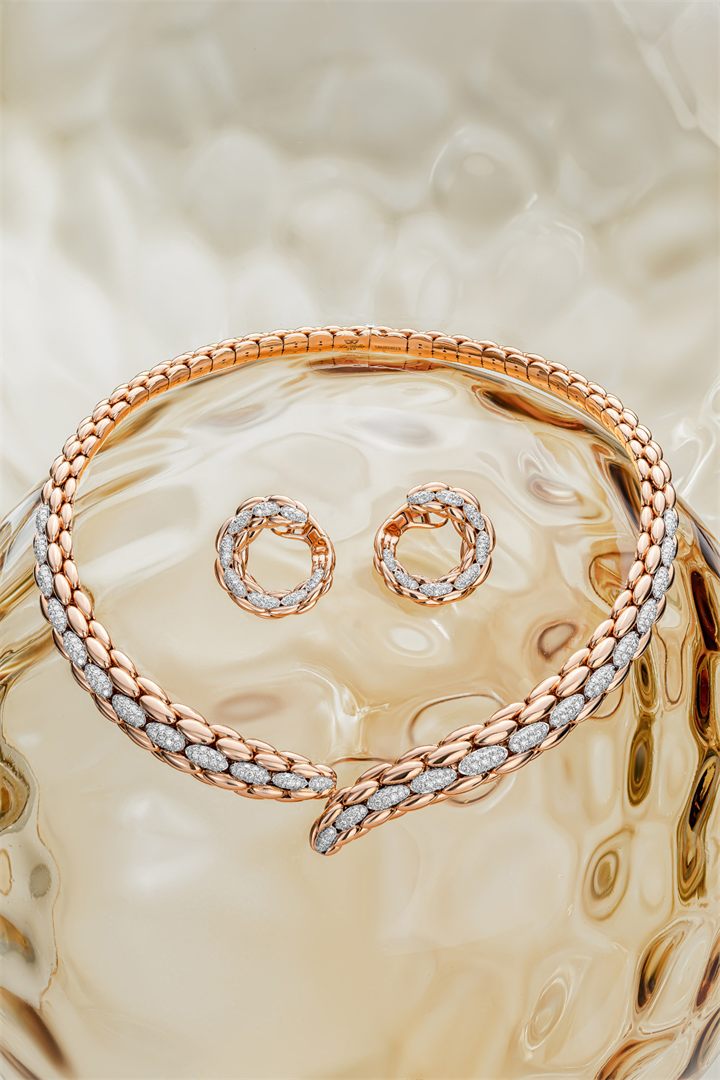 Rose gold and diamond bracelets and pendants on textured amber glass