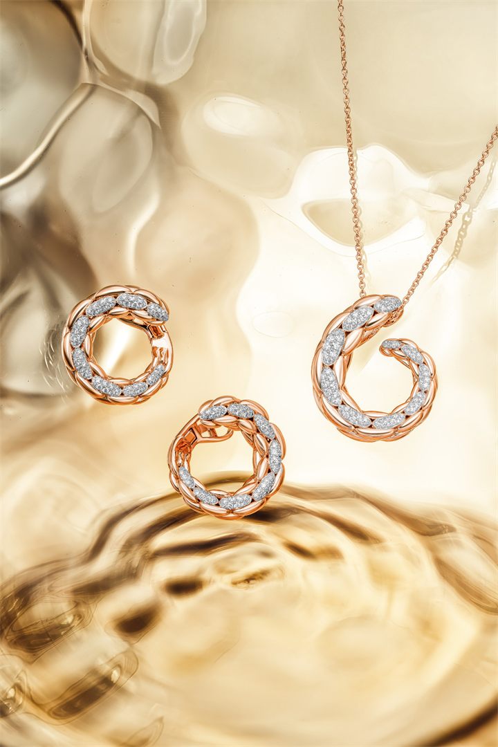 Rose gold and diamond bracelets and pendants on textured amber glass