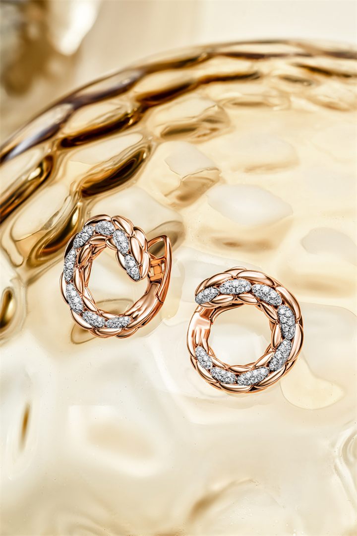 Rose gold and diamond bracelets and pendants on textured amber glass