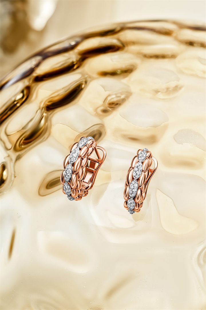 Rose gold and diamond bracelets and pendants on textured amber glass