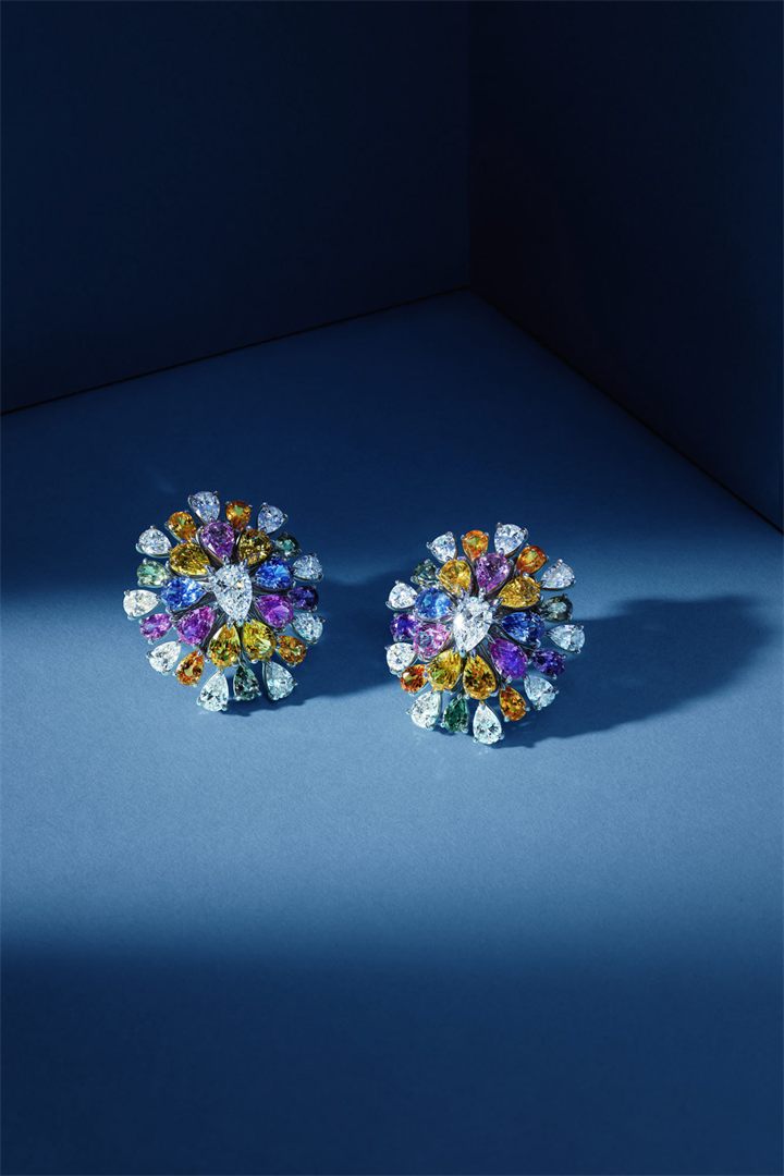 Diamond and coloured gemstone high jewellery on a navy sculpted set