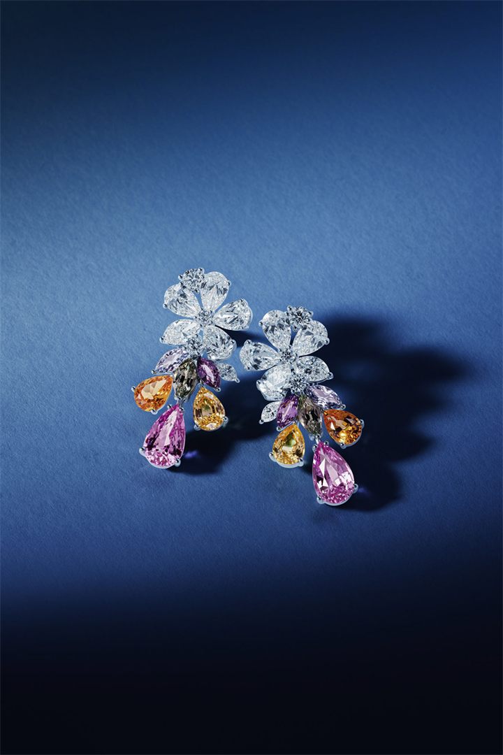 Diamond and coloured gemstone high jewellery on a navy sculpted set