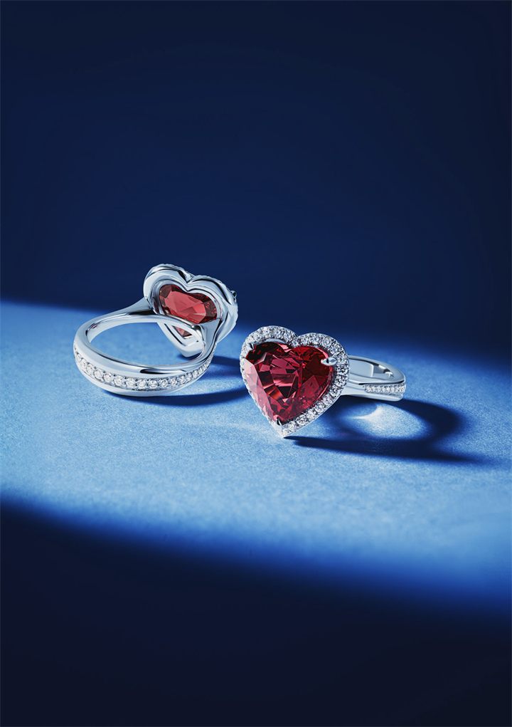 Diamond and coloured gemstone high jewellery on a navy sculpted set