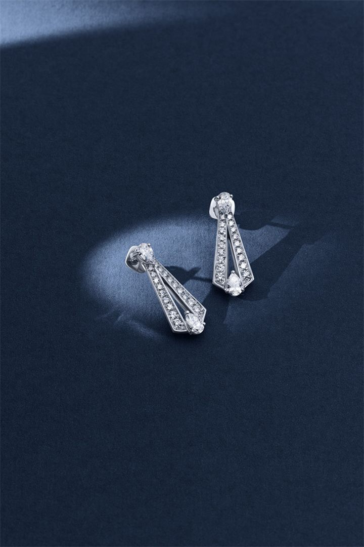 Diamond and coloured gemstone high jewellery on a navy sculpted set