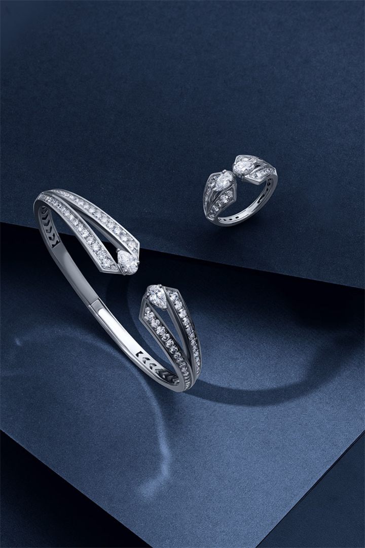 Diamond and coloured gemstone high jewellery on a navy sculpted set