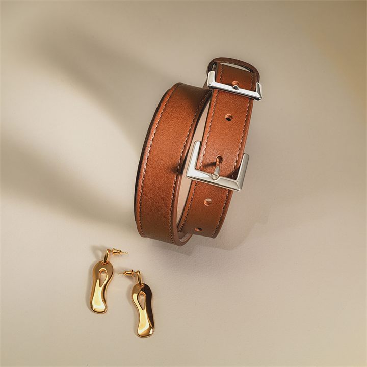 Leather belt with gold sandals charm, product photography in Dubai